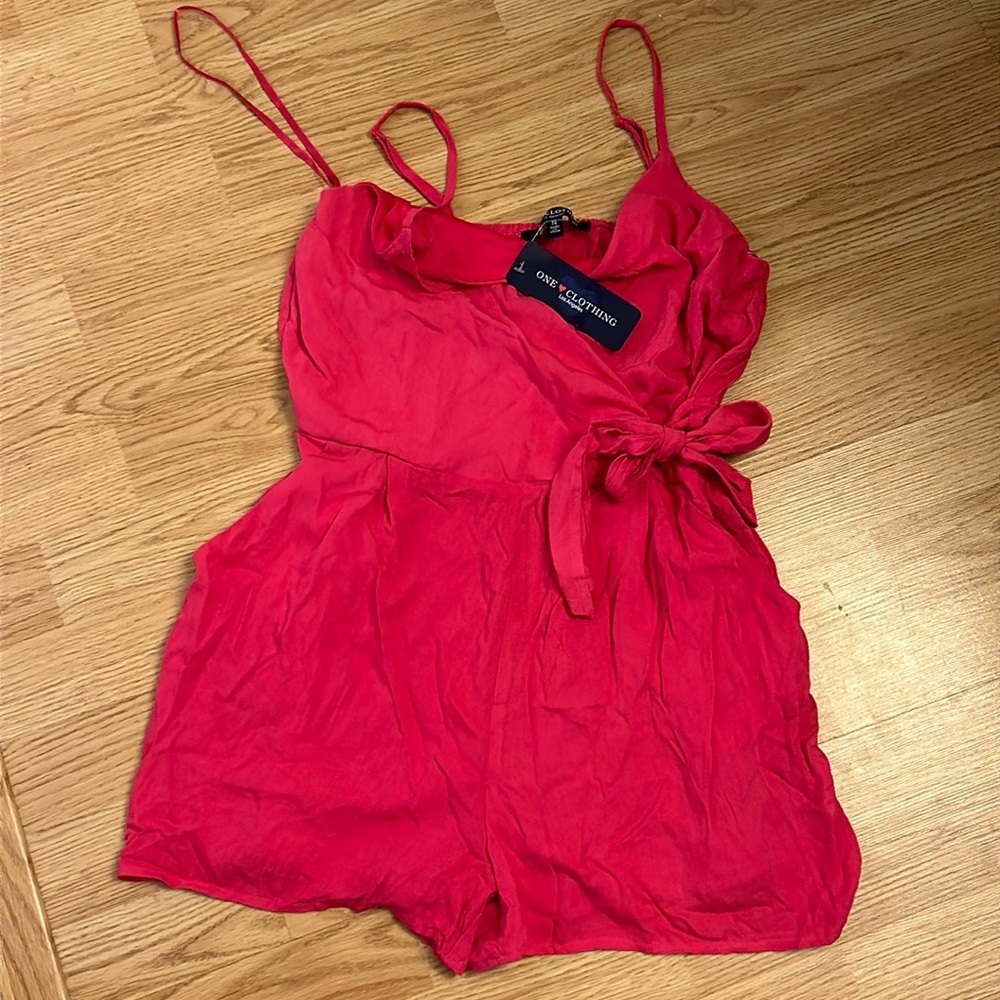 One clothing size small pink romper nwts​​